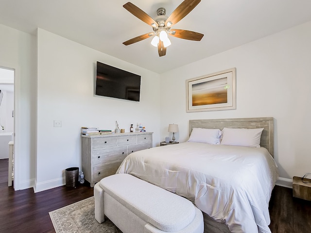 bedroom with dark hardwood / wood-style flooring and ceiling fan