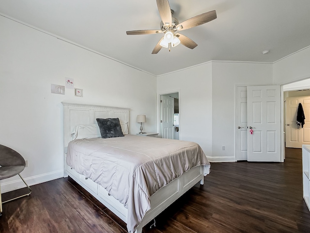 bedroom with dark hardwood / wood-style floors, ceiling fan, and ornamental molding