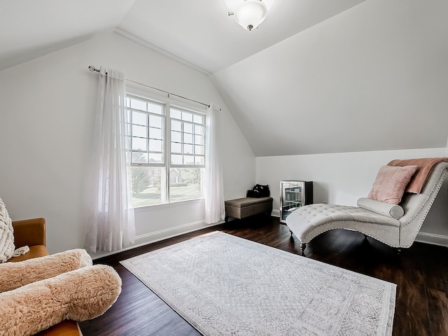 sitting room featuring lofted ceiling and dark hardwood / wood-style floors