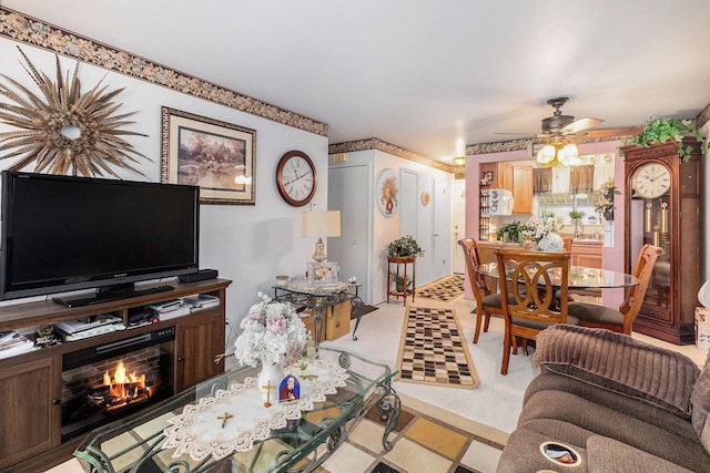 living room with ceiling fan and sink