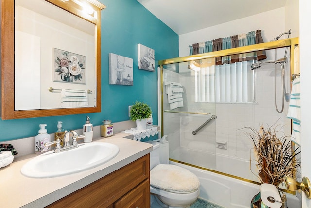 full bathroom featuring vanity, toilet, and enclosed tub / shower combo