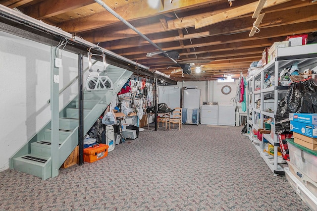 basement with carpet flooring and independent washer and dryer