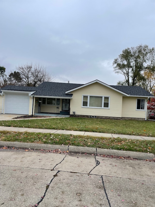 ranch-style house with a porch, a garage, and a front lawn