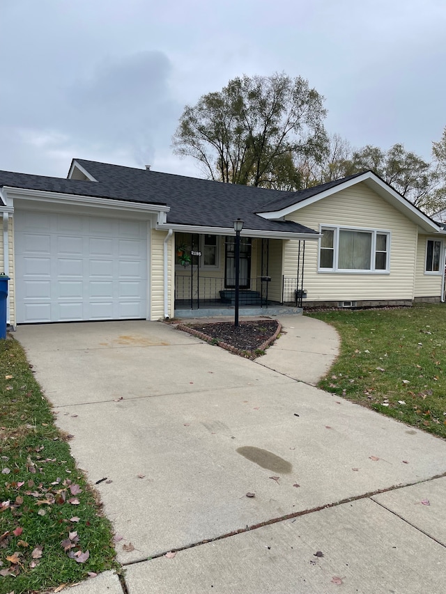 ranch-style home with a porch, a garage, and a front lawn