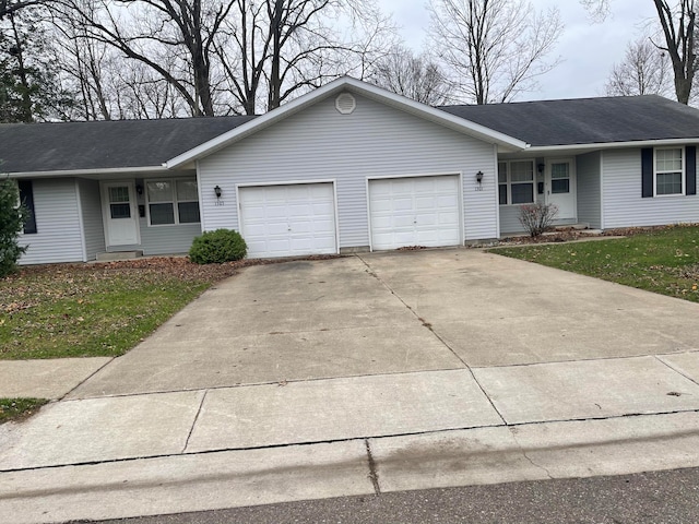 single story home featuring a garage