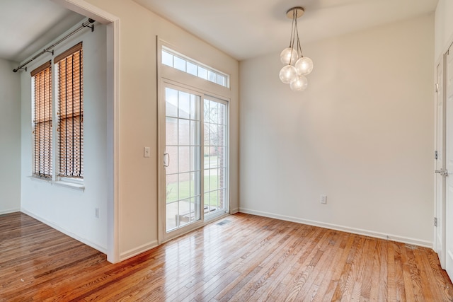 entryway featuring a healthy amount of sunlight and light hardwood / wood-style floors