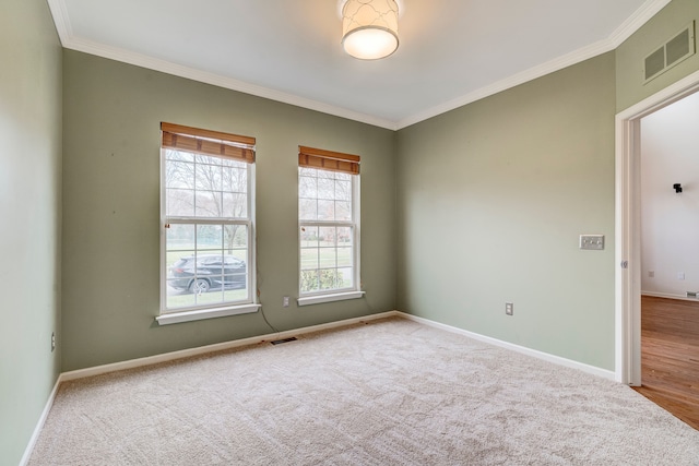 unfurnished room featuring carpet floors and crown molding