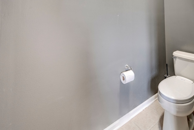 bathroom with tile patterned flooring and toilet