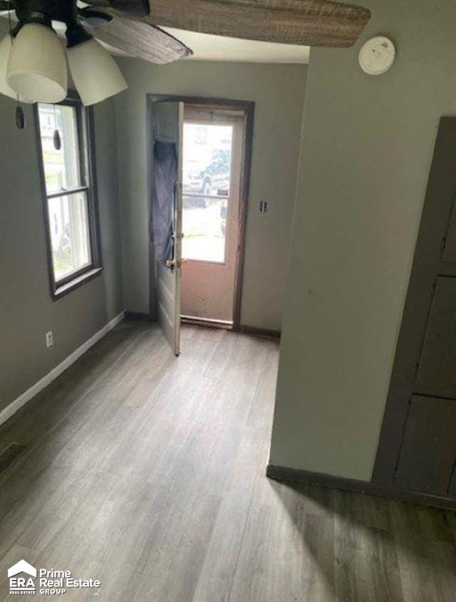 interior space featuring light wood-type flooring and ceiling fan