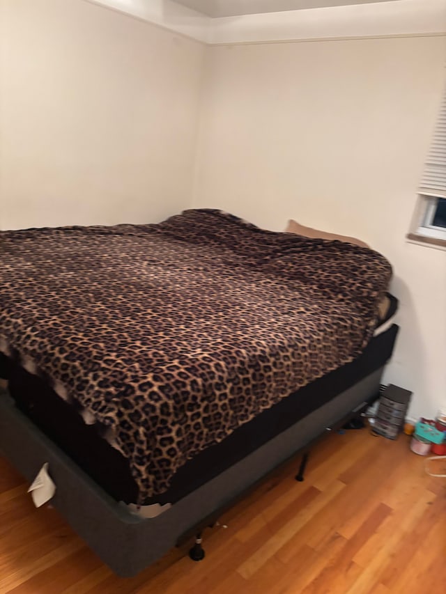 bedroom featuring wood-type flooring