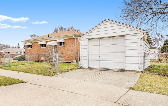 view of front of house with a garage, an outdoor structure, and a front yard