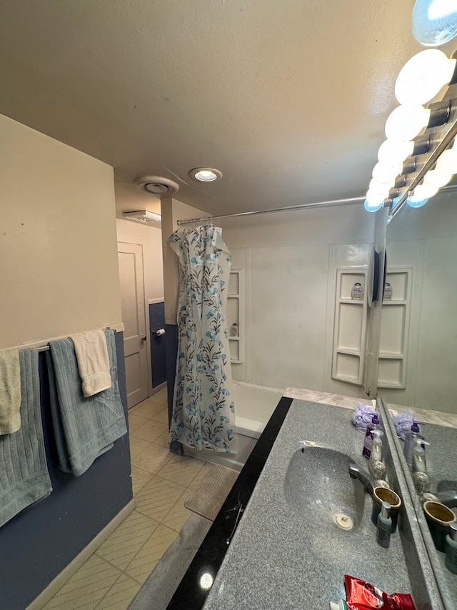 bathroom featuring vanity and shower / tub combo with curtain