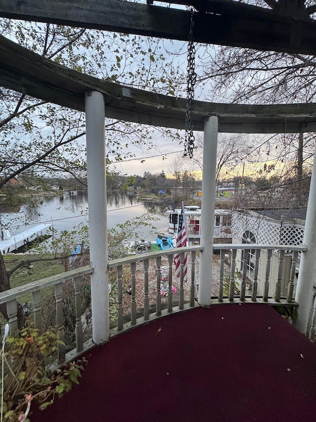 balcony at dusk with a water view