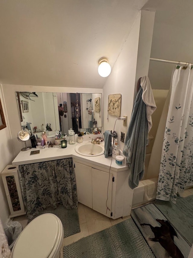 bathroom with tile patterned flooring, vanity, toilet, and a shower with shower curtain