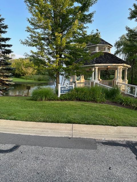 view of front of home with a gazebo and a water view