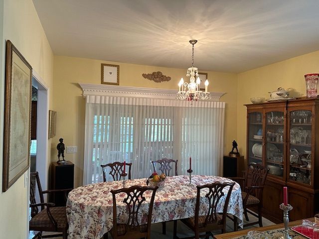 dining space with a chandelier