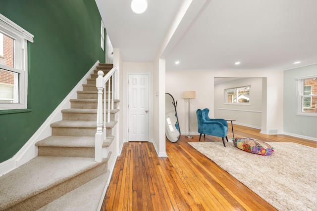 foyer entrance featuring wood-type flooring