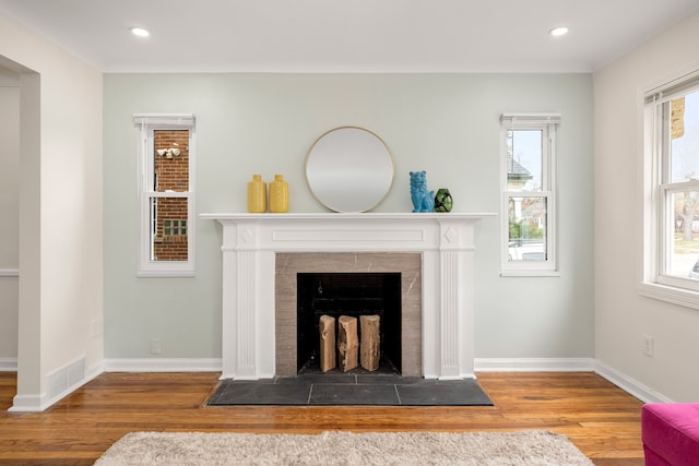 unfurnished living room with wood-type flooring