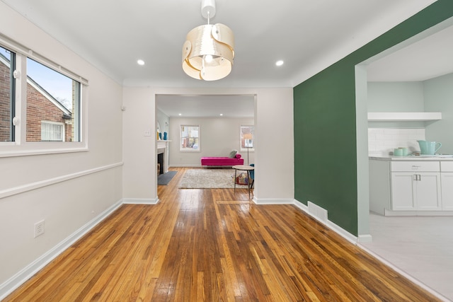 unfurnished dining area featuring light hardwood / wood-style flooring