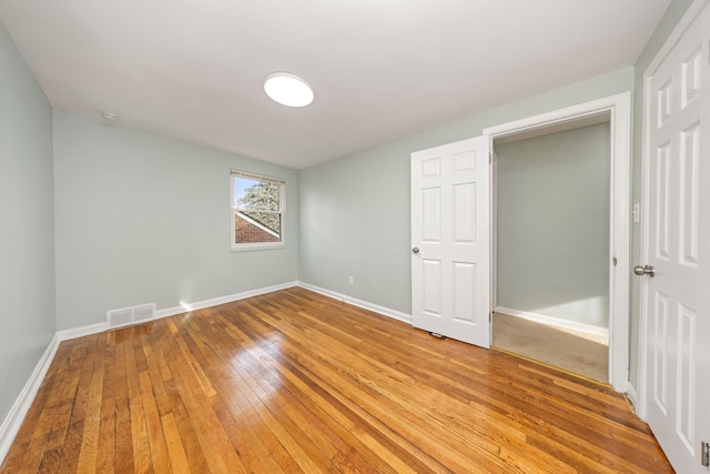 unfurnished bedroom with light hardwood / wood-style flooring