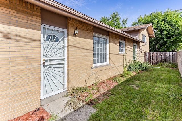 view of property exterior featuring a lawn