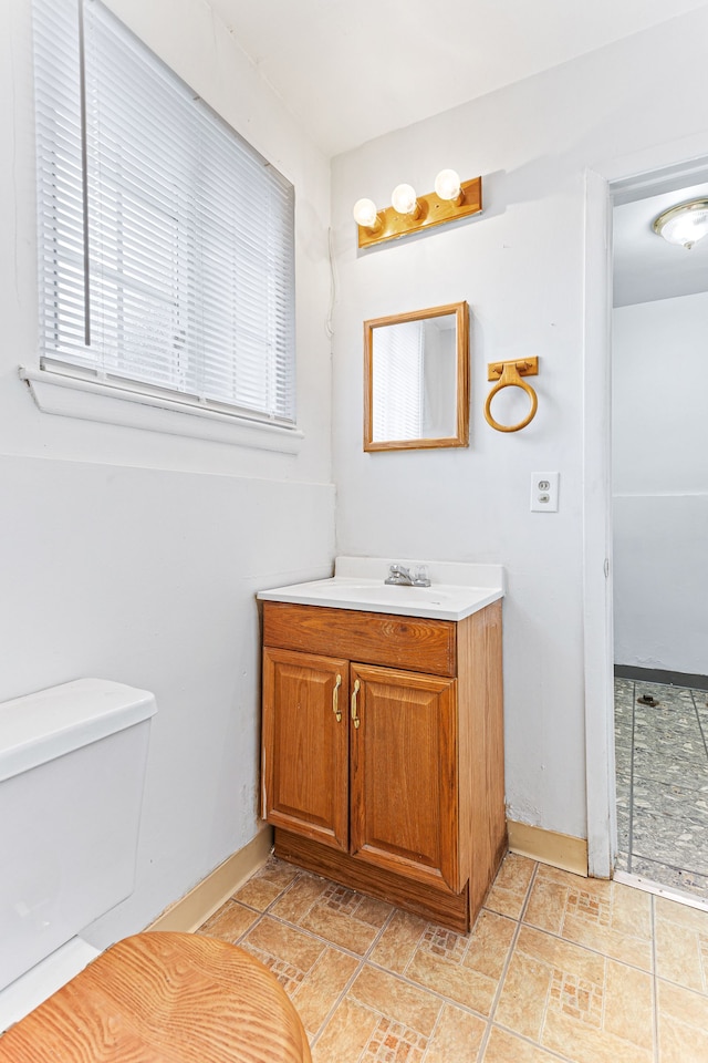 bathroom featuring vanity and toilet