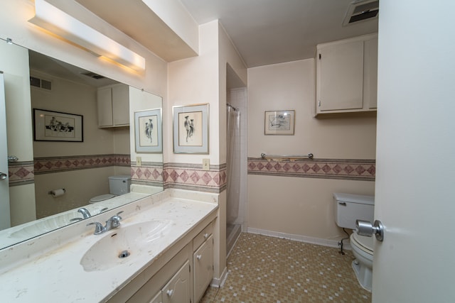 bathroom featuring vanity, a shower with curtain, tile patterned flooring, toilet, and tile walls