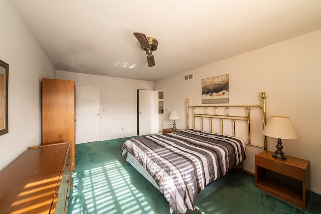 bedroom featuring dark colored carpet and ceiling fan