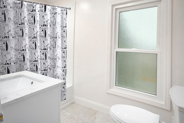 full bathroom with vanity, toilet, and shower / tub combo