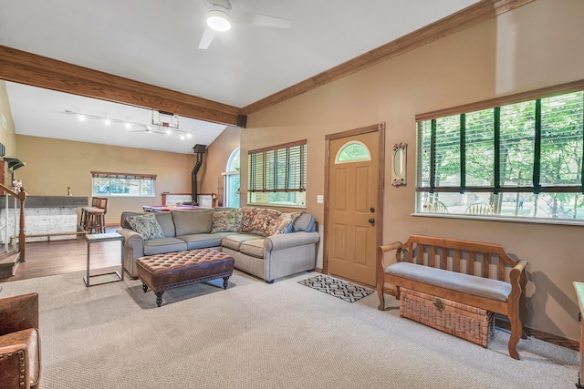 living room with light carpet, plenty of natural light, and ceiling fan