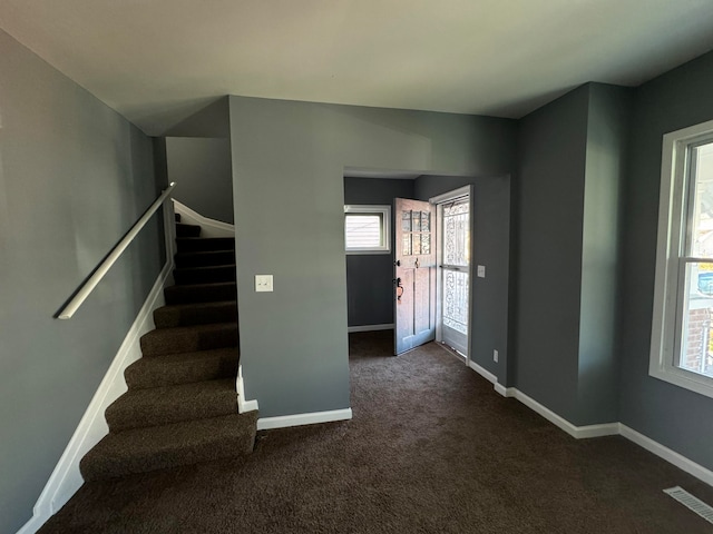 view of carpeted entrance foyer