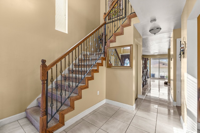 stairway featuring tile patterned floors