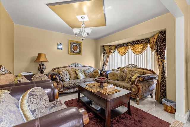 tiled living room featuring a chandelier