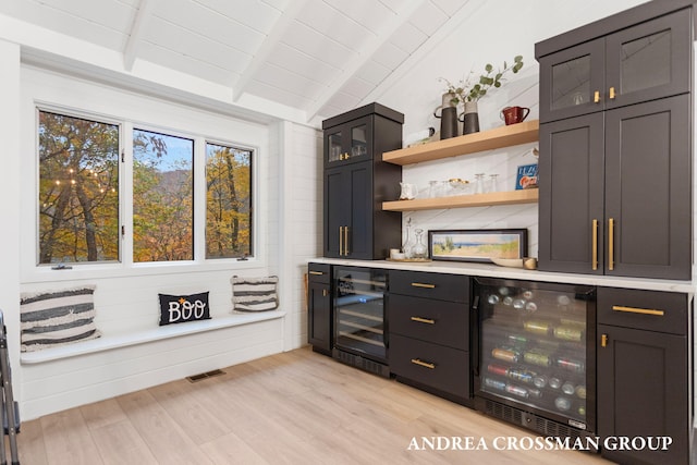 4719 Fox Hill Ln, Macatawa, MI 49434 - indoor dry bar with beverage cooler, light wood-style floors, and wooden ceiling