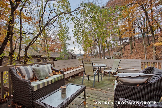 4719 Fox Hill Ln, Macatawa, MI 49434 - deck with outdoor dining space, a fenced backyard, and an outdoor living space
