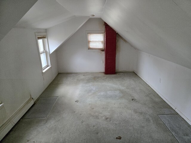25438 4th St, Grosse Ile, MI 48138 - additional living space featuring baseboard heating, lofted ceiling, and carpet