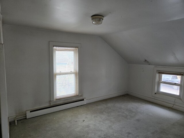 25438 4th St, Grosse Ile, MI 48138 - additional living space featuring a baseboard heating unit, lofted ceiling, and carpet
