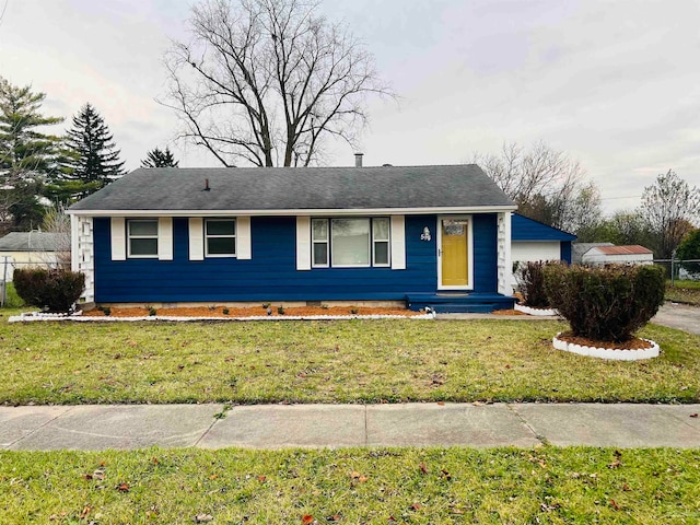 single story home with a front yard