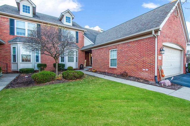 view of front of property featuring a garage and a front lawn