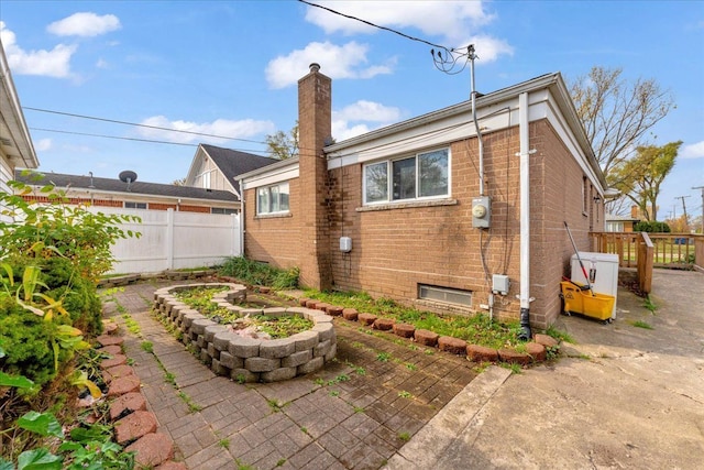 back of house with a patio