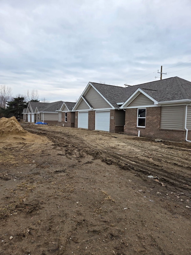 18750 14 Mile Rd, Roseville, MI 48066 - view of front of home featuring brick siding and a garage
