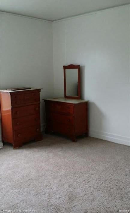 unfurnished bedroom featuring light colored carpet