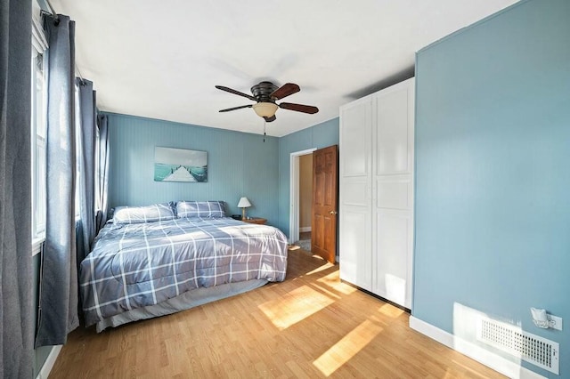 bedroom featuring light hardwood / wood-style floors and ceiling fan