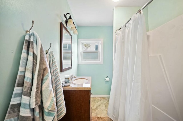 bathroom featuring curtained shower and vanity