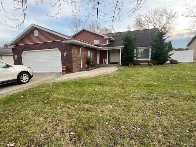 ranch-style home featuring a garage and a front lawn