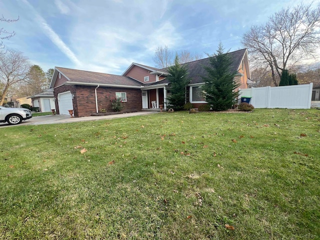 view of front of property featuring a garage and a front yard