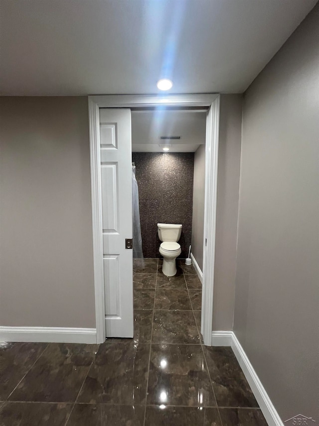 bathroom featuring toilet