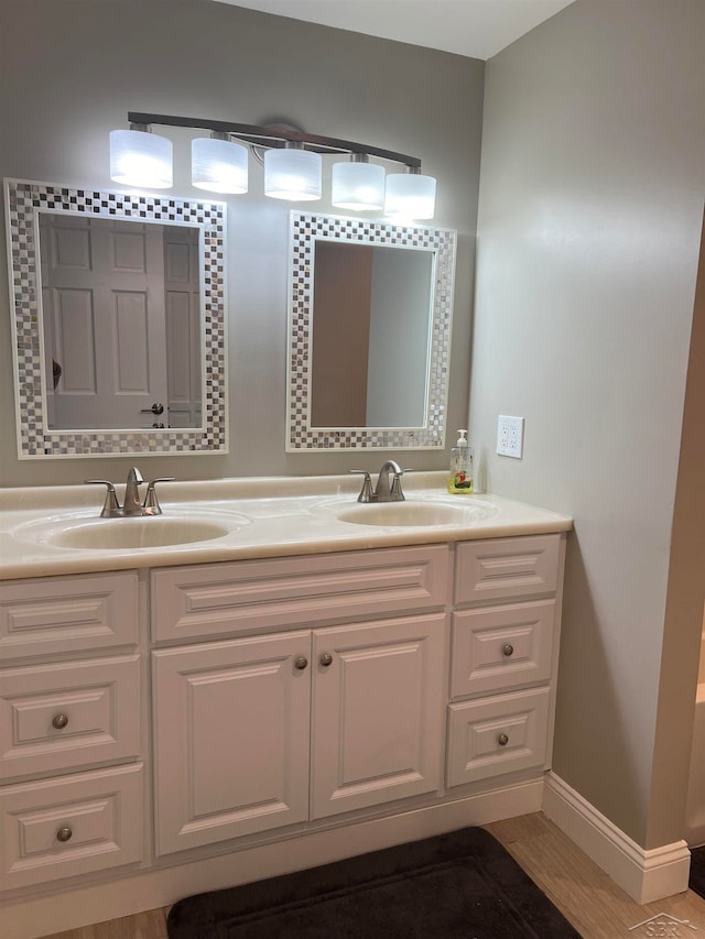 bathroom featuring vanity and hardwood / wood-style flooring