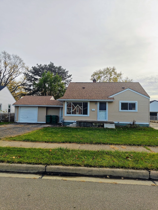 view of front facade featuring a garage and a front lawn