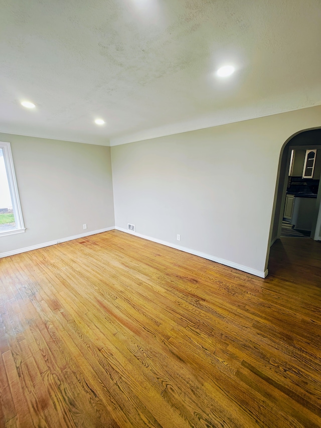 empty room with wood-type flooring